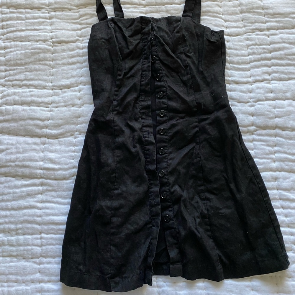 little black linen dress with adjustable straps. Super fun and cute! F21 Small